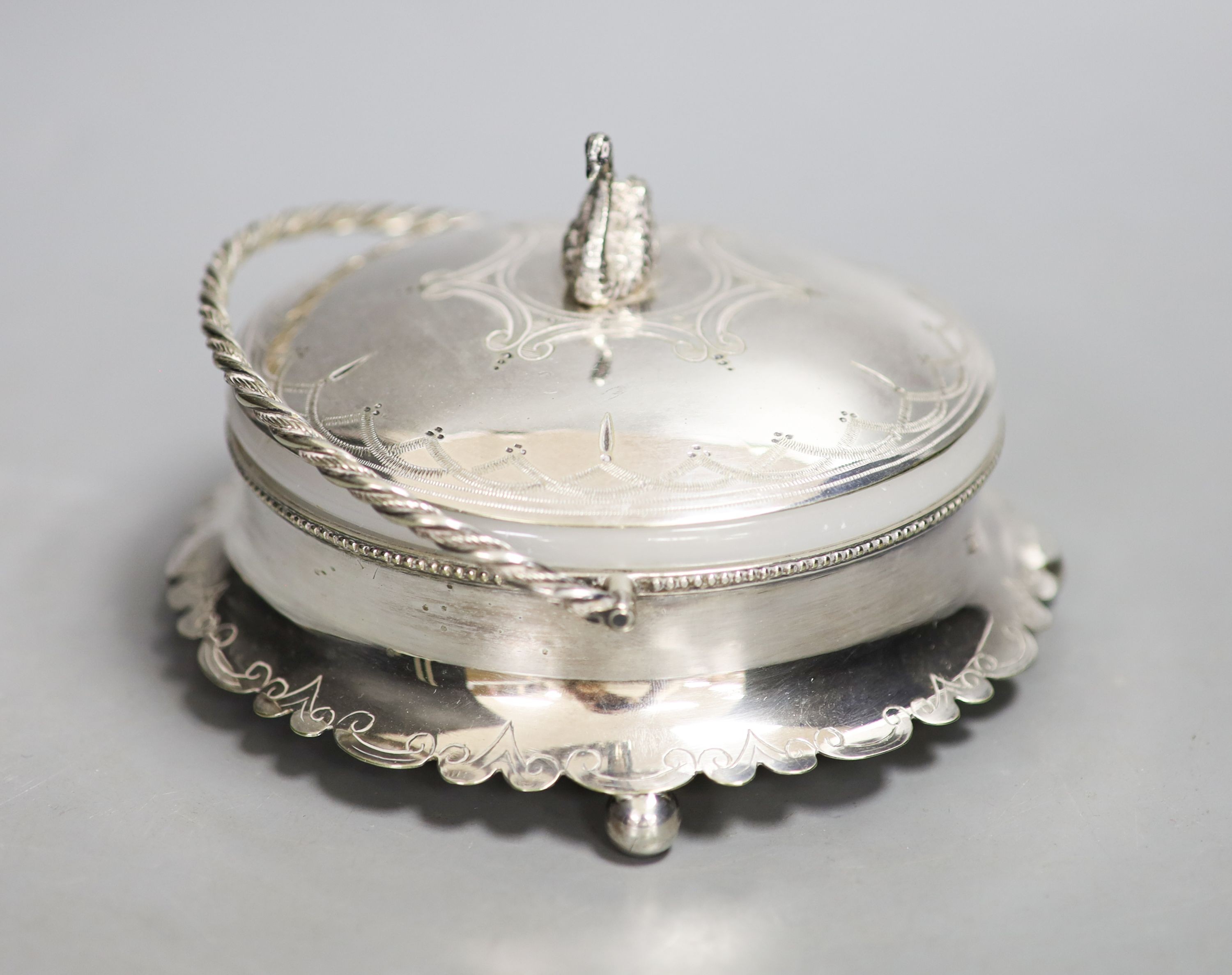 A silver plated powder box, the lid with swan finial.